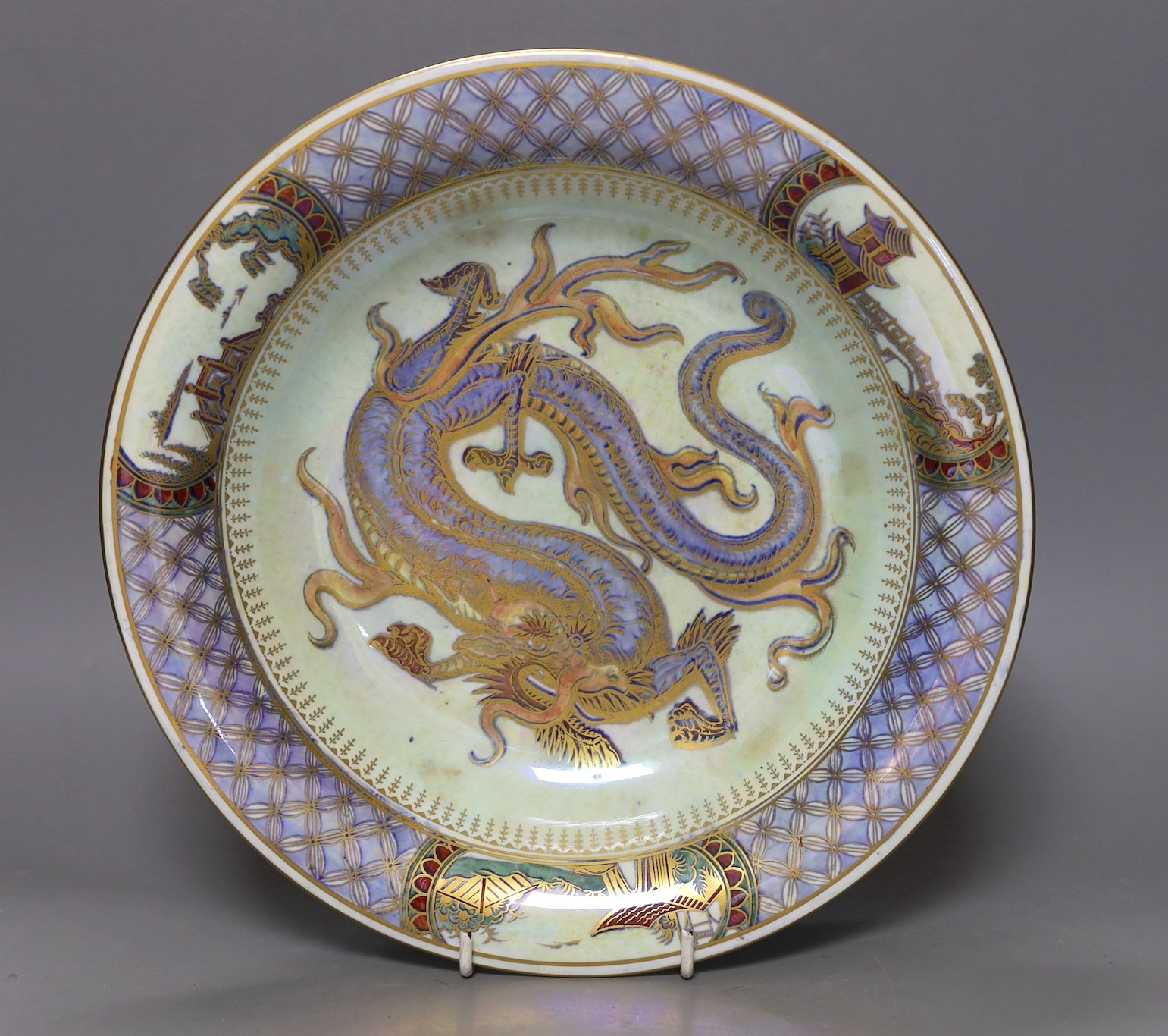 A large Wedgwood lustre dragon shallow bowl, designed by Daisy Makeig-Jones, pattern no. Z4829, 28cms diameter